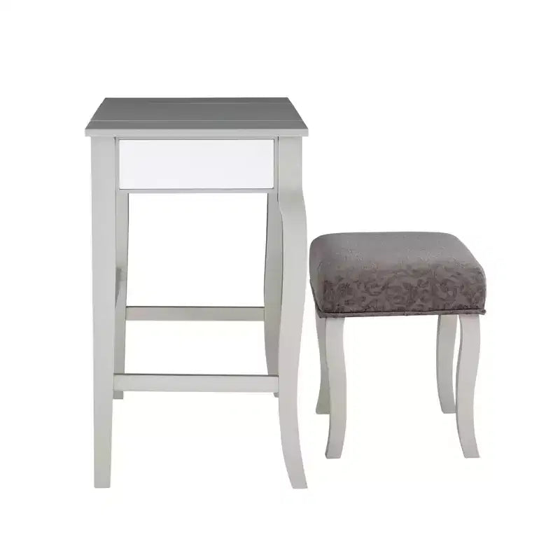 Tocador con espejo plateado abatible y taburete gris, 1 persona